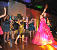 Click to Enlarge Girls in formal dresses on the dance floor